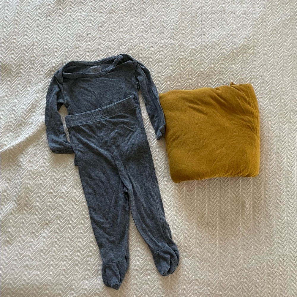 Solly Baby saffron wrap and gray newborn sleeper